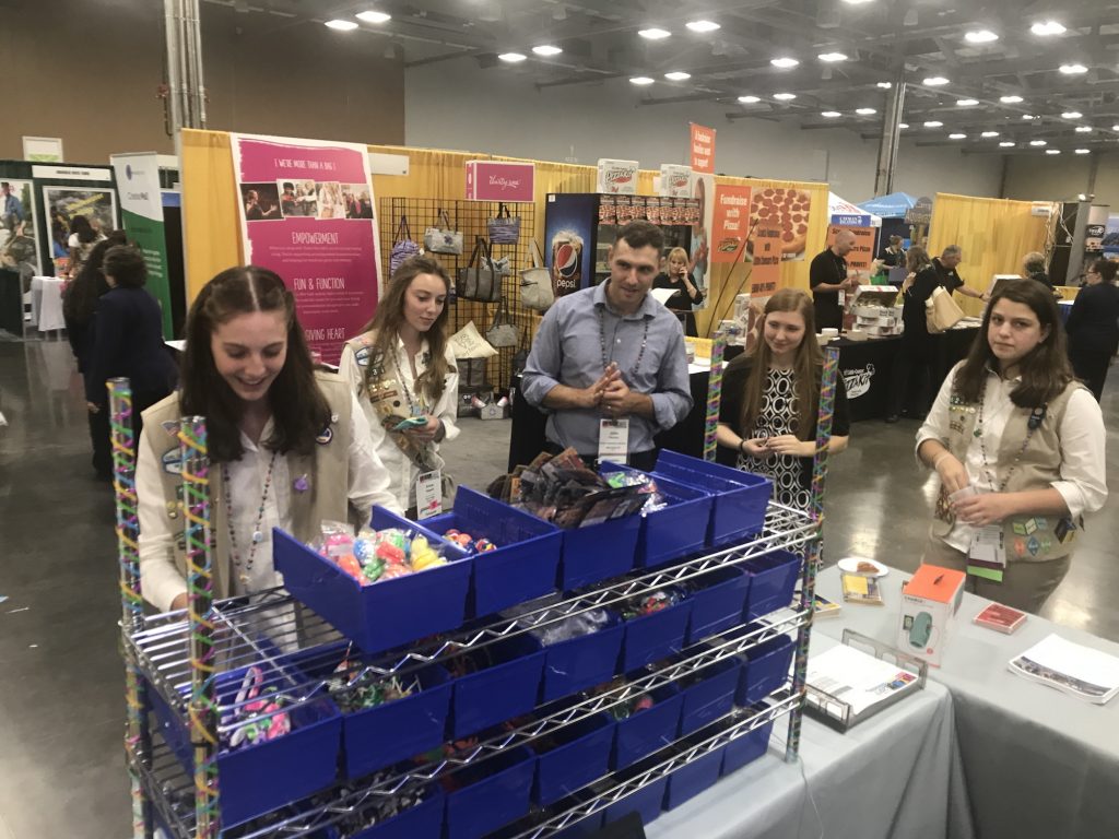 Girl tries the pick and pack station at GIRL 2017.