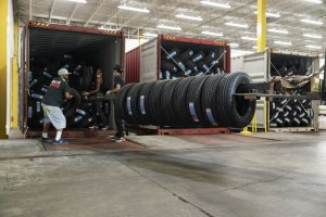 Unloading more tires