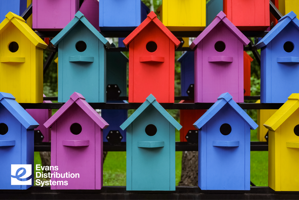 Array of colorful bird houses representing diversification.